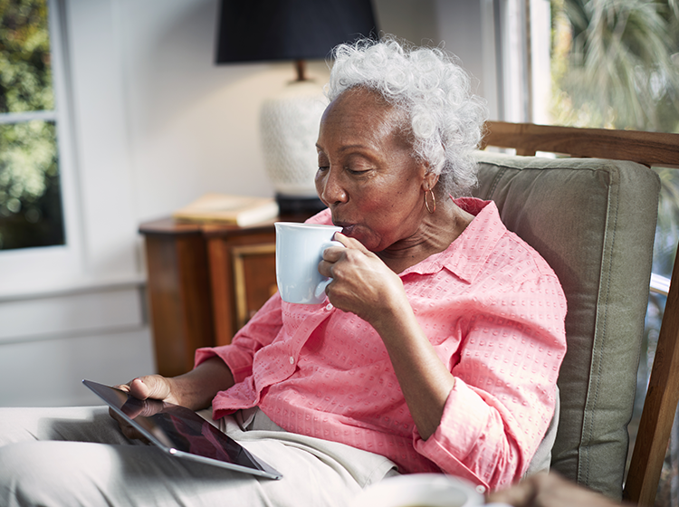 a woman looking at her tablet learning about medicare myths